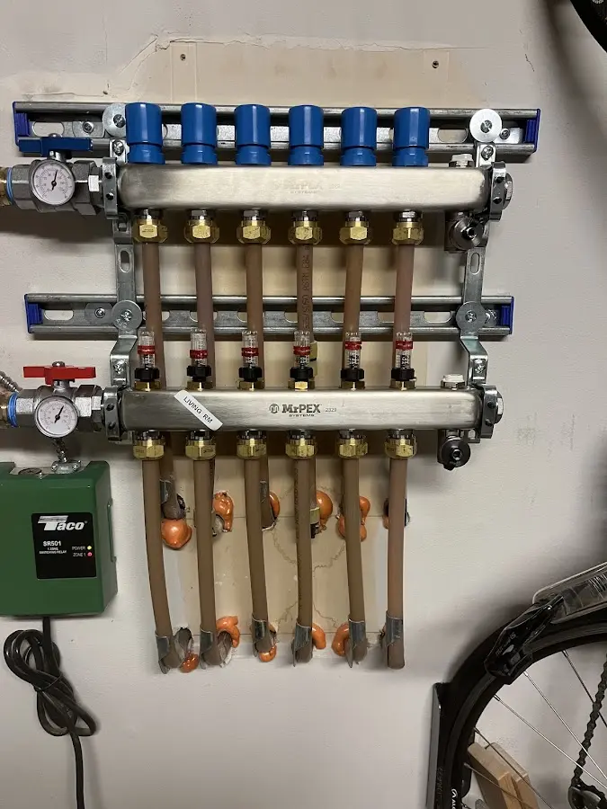 Plumber performing Water Heater Repair at a residential property in Centerville